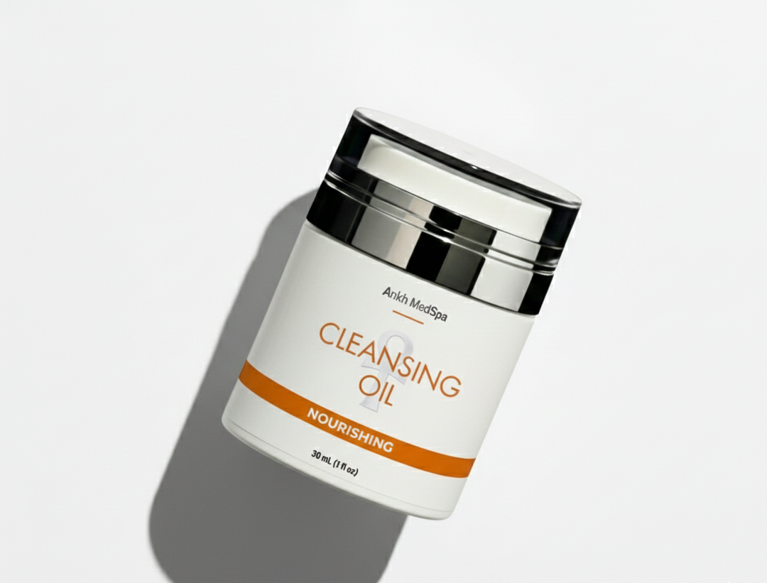 Cleansing oil container with a white label on a light gray background