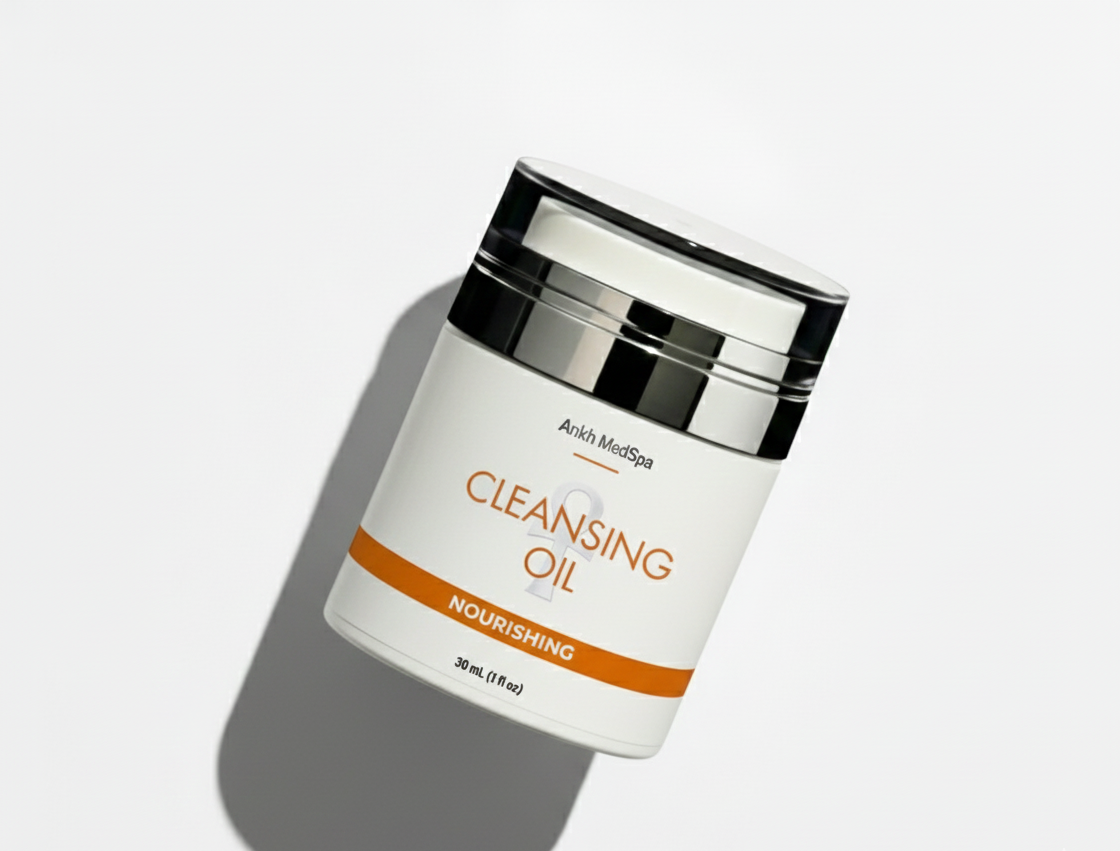 Cleansing oil container with a white label on a light gray background