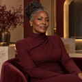 Sovereign Membership at Ankh MedSpa — editorial portrait of a woman in burgundy