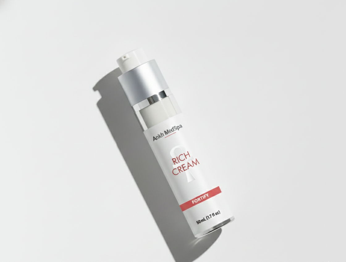 Skincare bottle labeled 'Rich Cream' on a light gray background